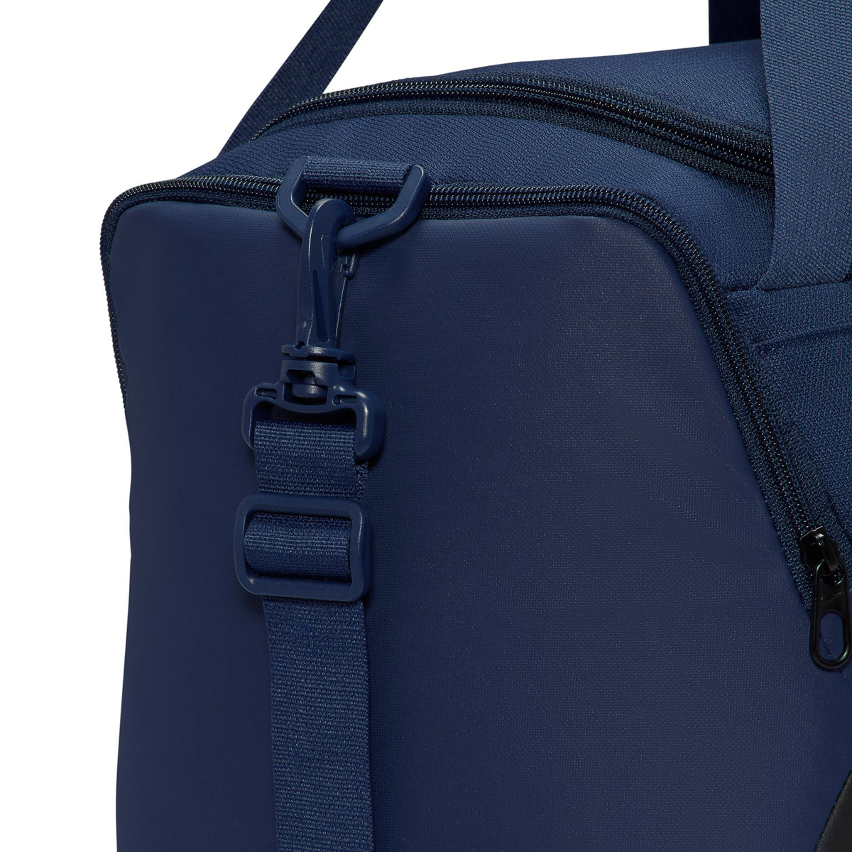 Nike Brasilia extra small 24L duffel bag in Midnight Navy, shoulder strap attachment detail