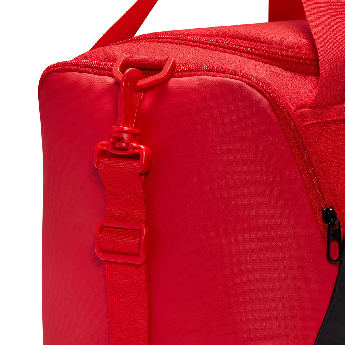 Nike Brasilia extra small 24L duffel bag in University Red, shoulder strap attachment detail