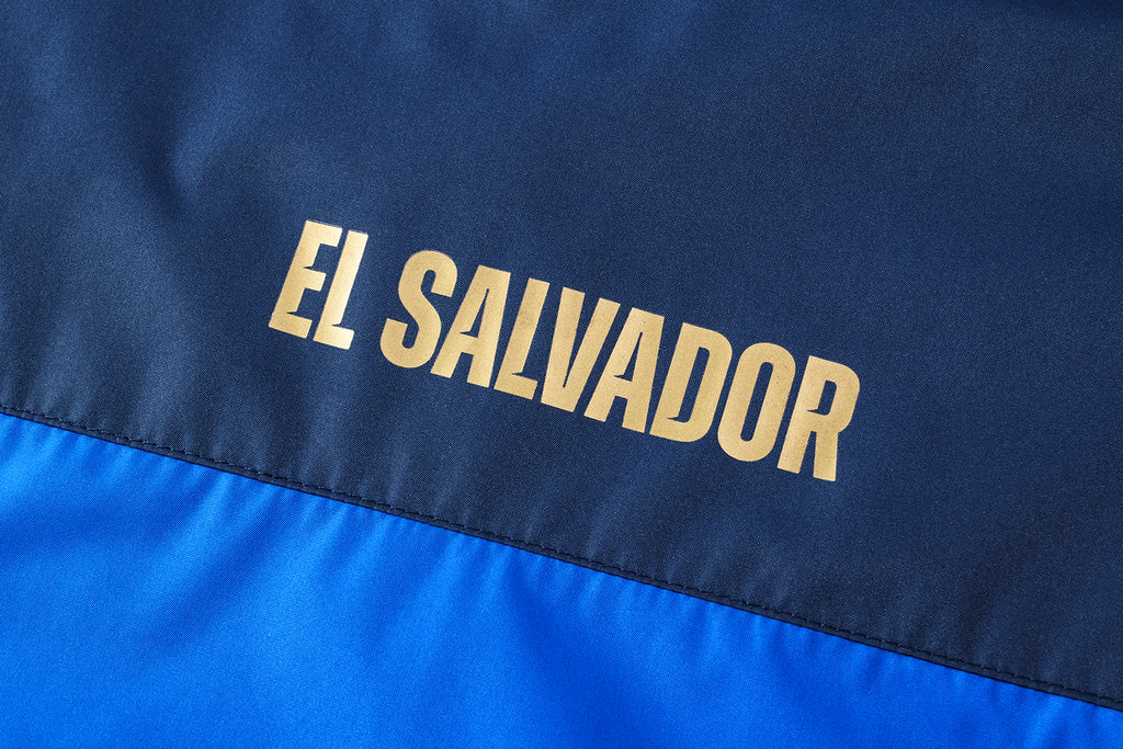 Umbro Men's El Salvador Rain Jacket 2023 - UUM1ESJK52207-TMC-UMBRO by Umbro | Available at Niky's Sports