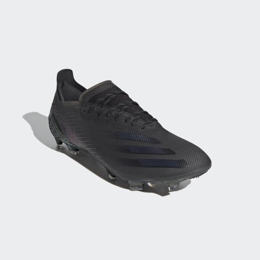 X GHOSTED.1 FIRM GROUND SOCCER CLEATS