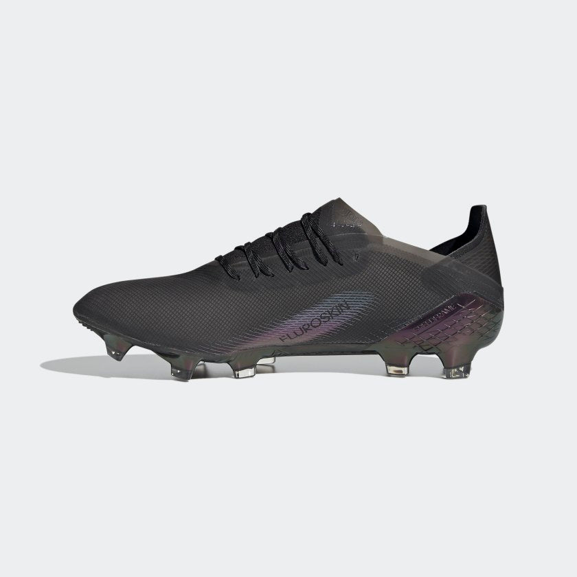 X GHOSTED.1 FIRM GROUND SOCCER CLEATS
